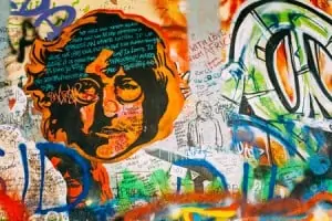51412513 - prague, czech republic - october 10, 2014: famous place in prague - the john lennon wall. wall is filled with john lennon inspired graffiti and lyrics from beatles songs